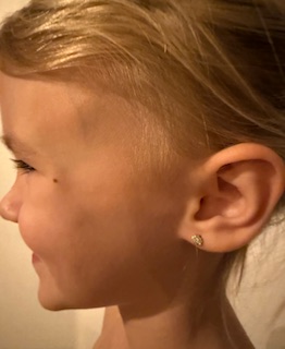 Children's first piercing by Emerald & Opal