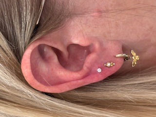Triple lobe piercing by Emerald & Opal
